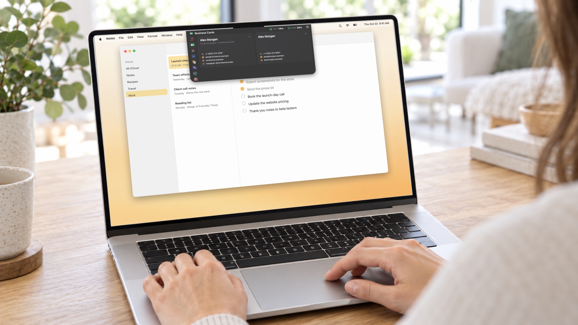 AI-generated illustration: Hands on a MacBook trackpad, Brow's business cards open at the top of the screen